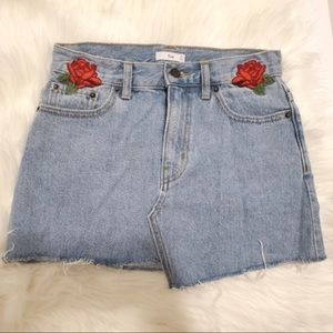 Aritzia TNA light wash denim mini skirt with embroidered roses